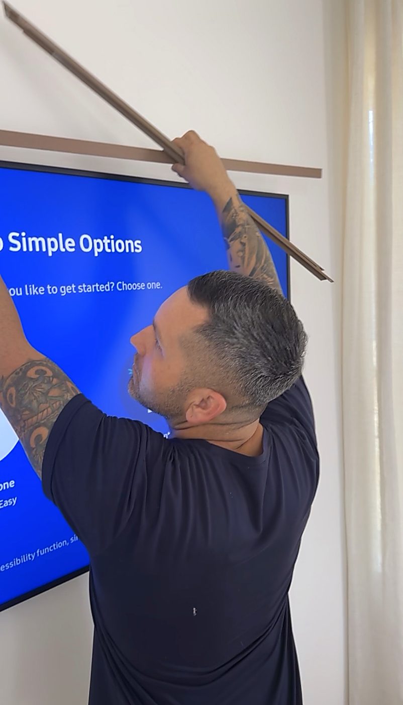 James leveling a Frame TV install